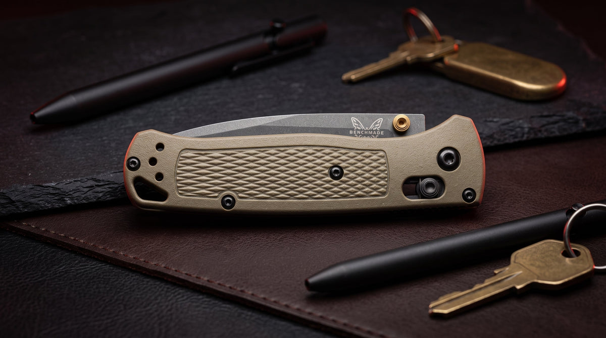 A collection of modern EDC folding knives arranged on tactical outdoor gear.